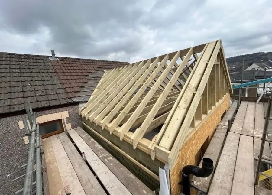 New timber rafters and gable frame for an extension roof, before membrane and tiles